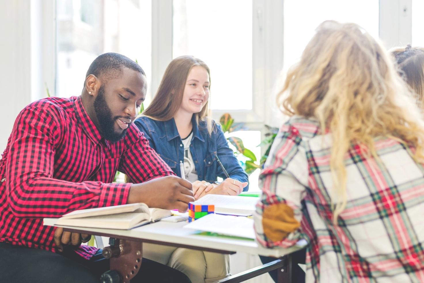 Financial analyst examining market data and economic indicators on multiple screens